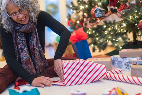Woman wrapping a holiday gift