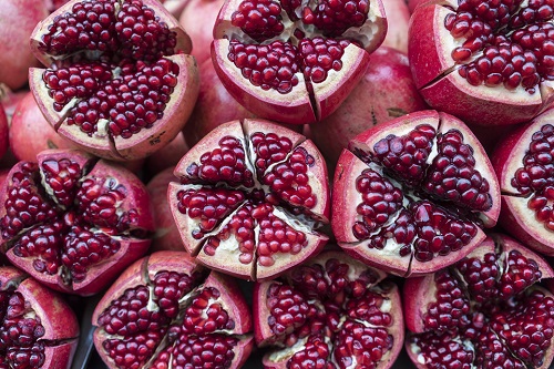 Close up of pomegranate halves on a table